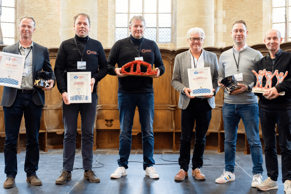 De winnaars van de Nationale evenementenprijzen 2023 op het podium